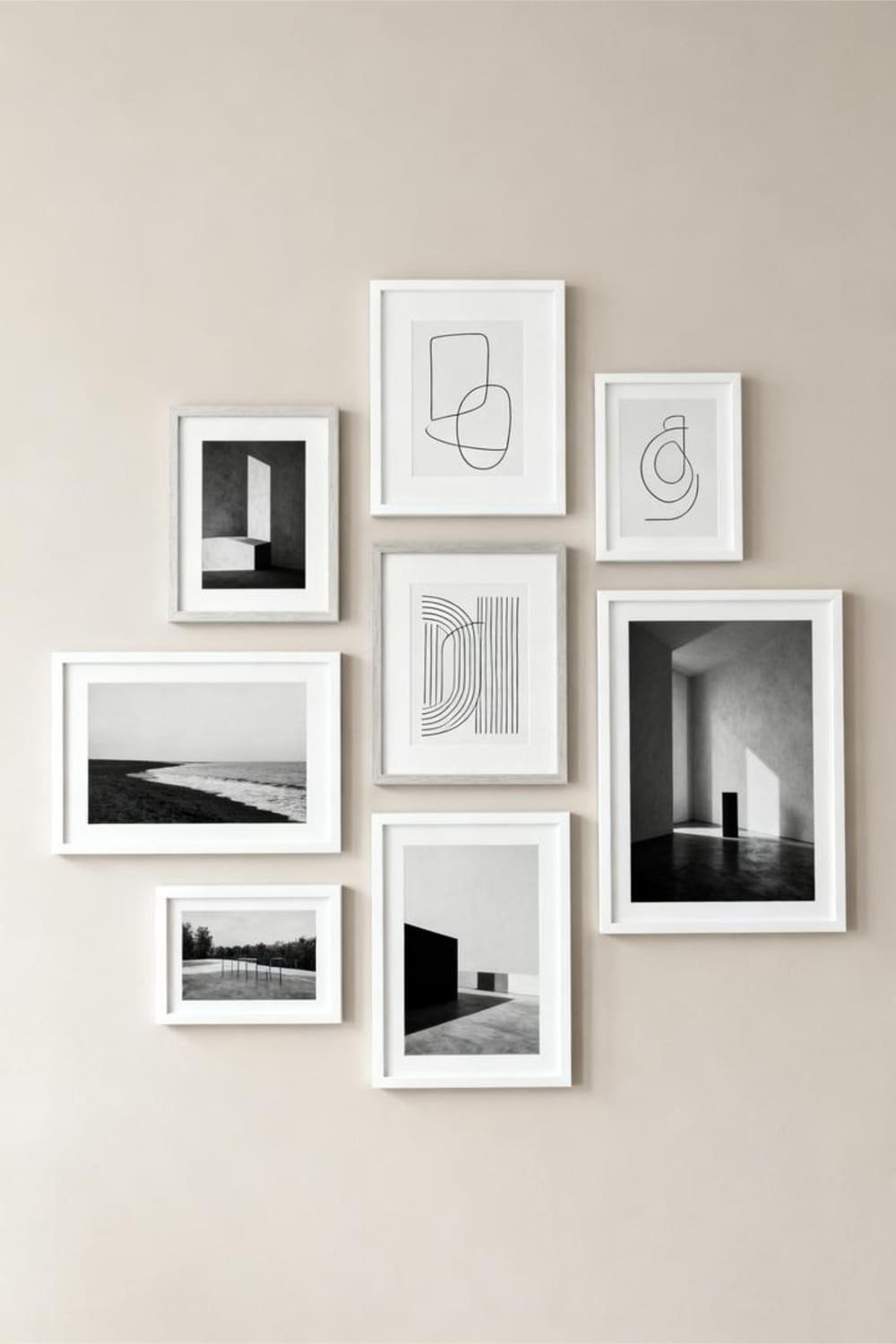 Minimalist gallery wall with abstract line art and simple black-and-white prints