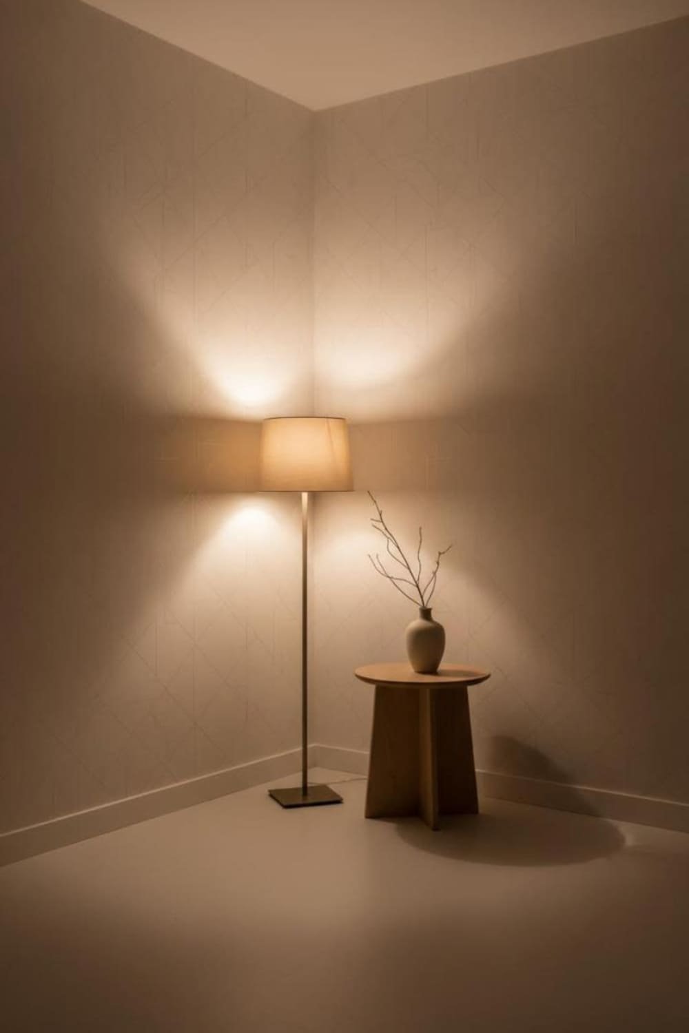 Room with light-colored wallpaper in soft white tones that reflects available light to brighten a dim space.