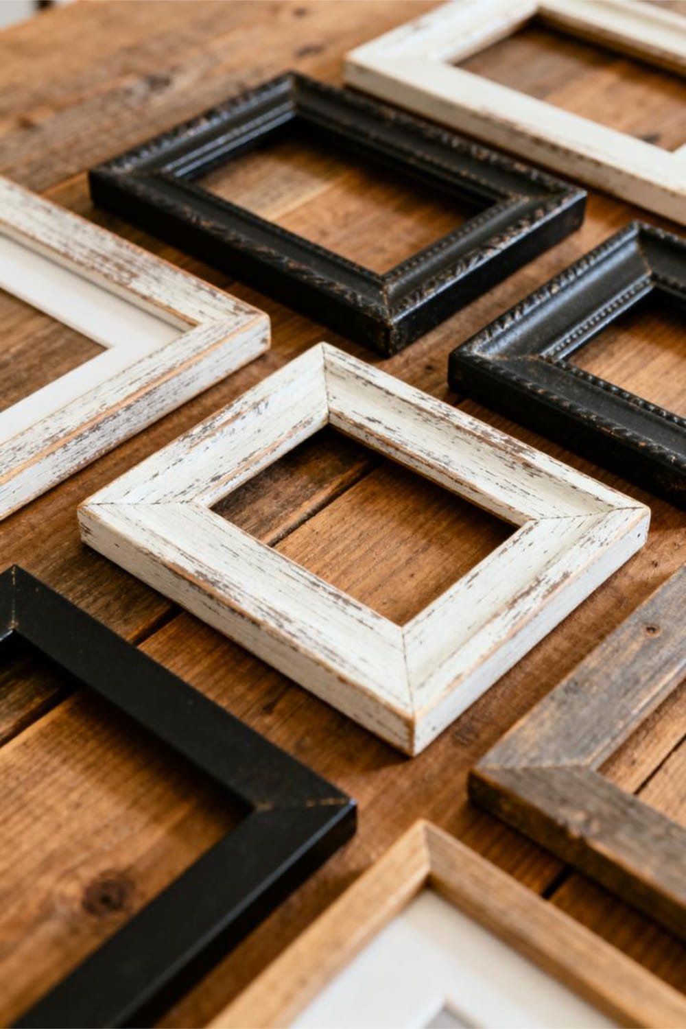 A selection of rustic farmhouse picture frames in distressed wood and metal textures.