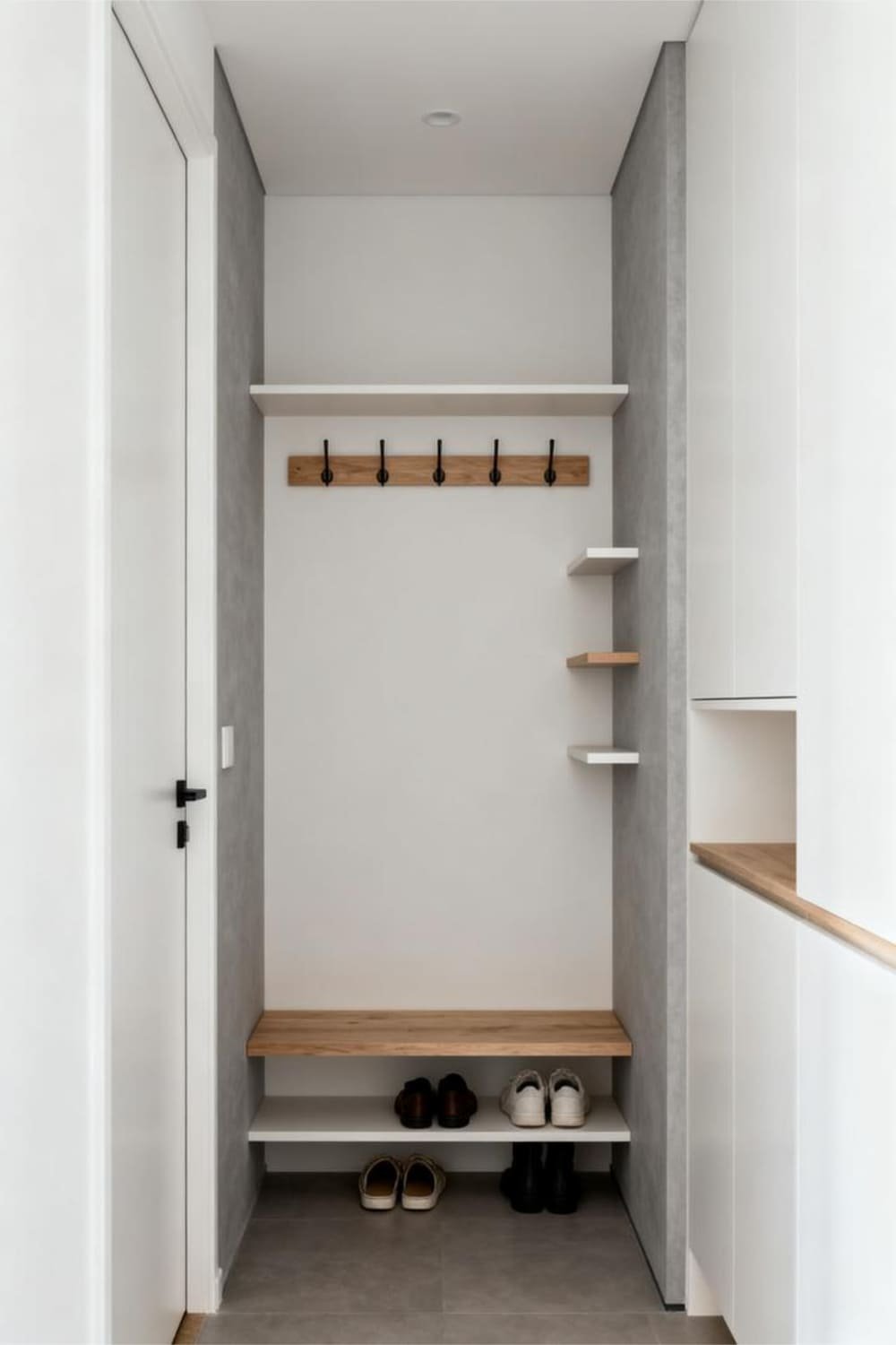 Narrow mudroom design with low-profile hook rails, slim shoe shelves, and shallow floating shelves for tight spaces.
