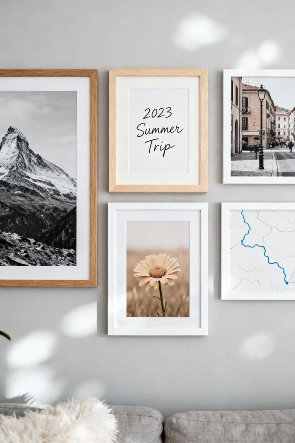 A Scandinavian gallery wall with personal touches like travel photos and sketches.